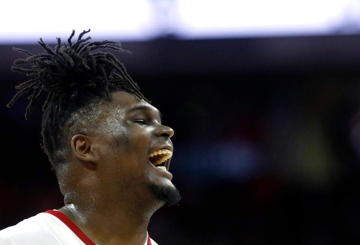 N.C. State’s DJ Burns Jr. laughs during a timeout in the first half of the Wolfpack’s 76-60 win over Virginia on Saturday, Jan. 6, 2024, at PNC Arena in Raleigh, N.C.