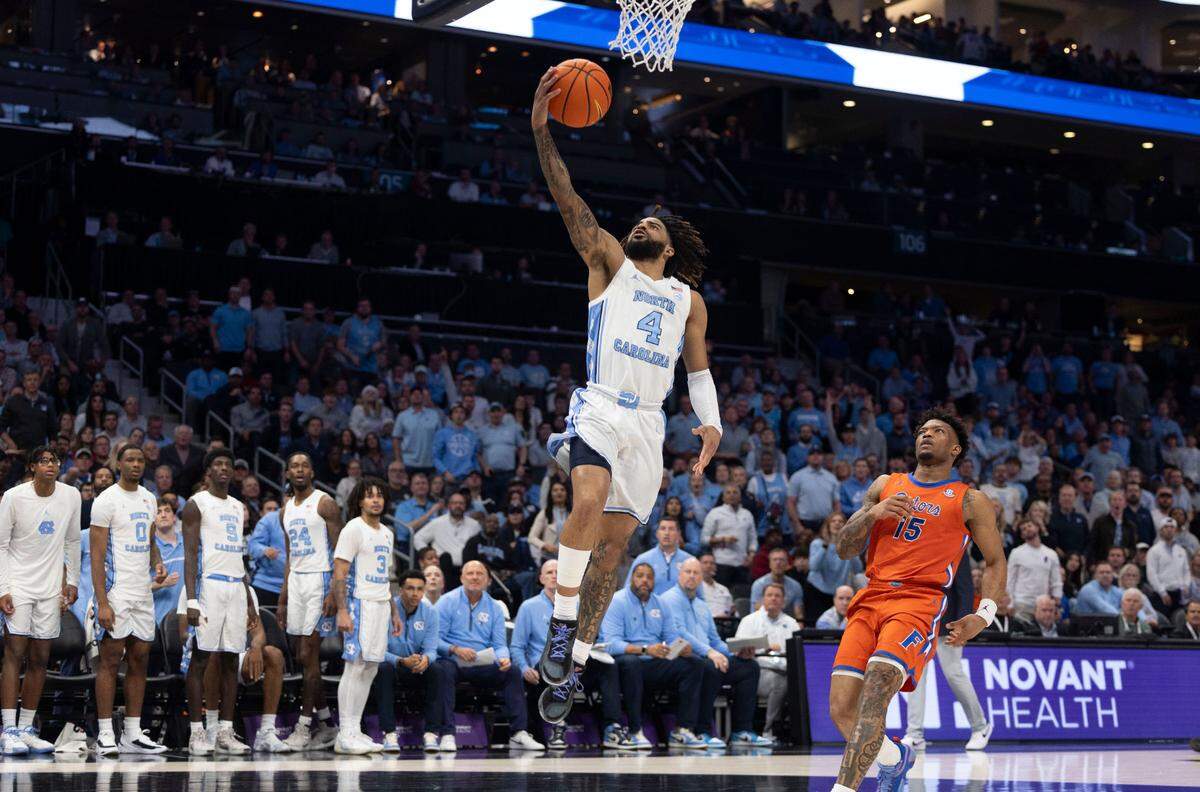 North Carolina guard R.J. Davis (4) drives to the basket past Florida’s Alijah Martin (15) for two of his game high 29 points in the second half during the Jumpman Invitational on Tuesday, December 17, 2024 at the Spectrum Center in Charlotte, N.C. Florida defeated North Carolina 90-84.