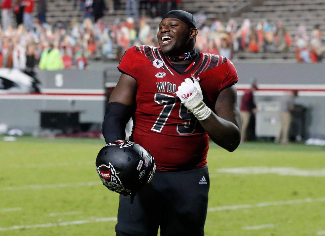 N.C. State offensive tackle Ikem Ekwonu (79) laughs as he leaves the field after N.C. State’s 38-22 victory over Florida State at Carter-Finley Stadium in Raleigh, N.C., Saturday, Nov. 14, 2020.