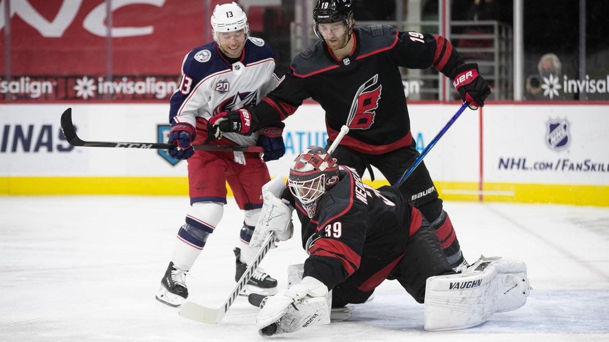 Carolina Hurricanes’ goalie Alex Nedeljkovic (38) stop an early shot on goal by Columbus in the first period on Thursday, March 18,, 2021 at PNC Arena in Raleigh, N.C.
