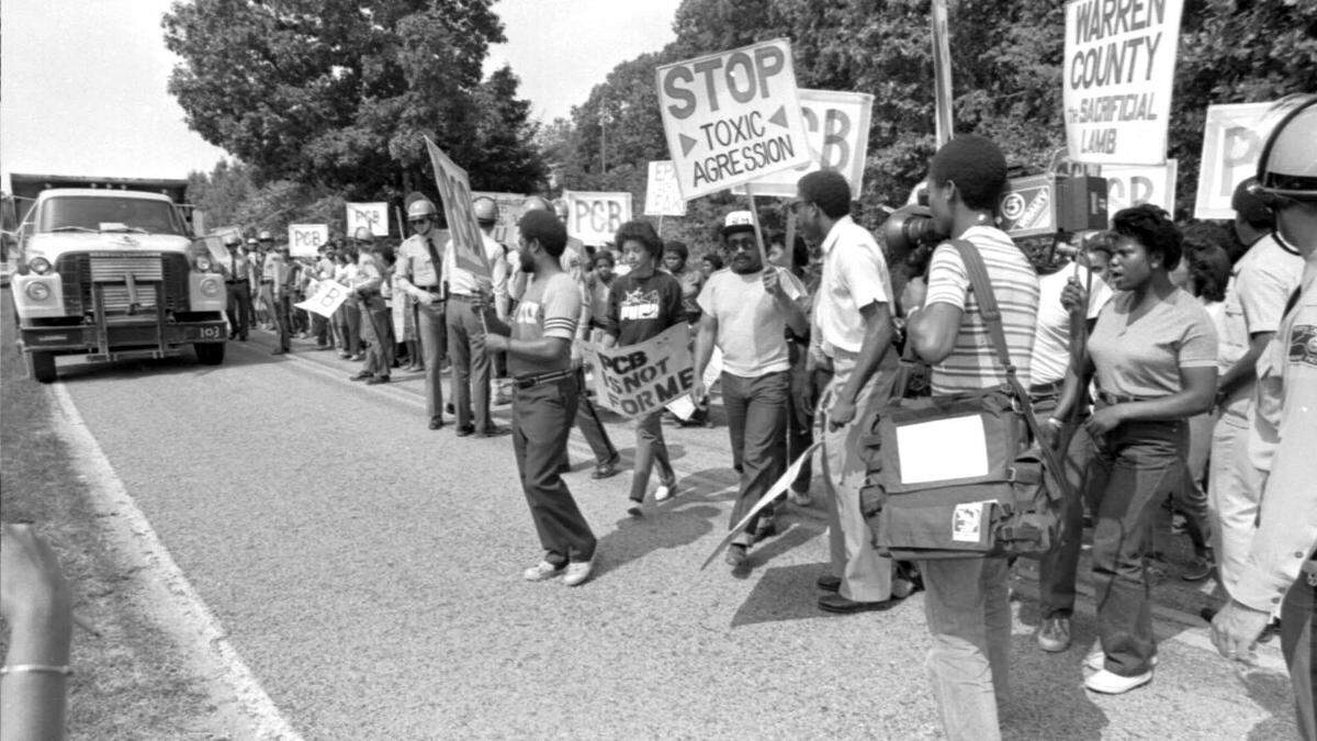 Protesters march in Warren County, NC in 1982 after a landfill for PCB’s was placed near the community of Afton. trucks belonging to the Ward Transformer Company deliberately released toxic chemicals called PCBs along 250 miles of North Carolina roadways. Once uncovered, the waste had to be collected and contained.