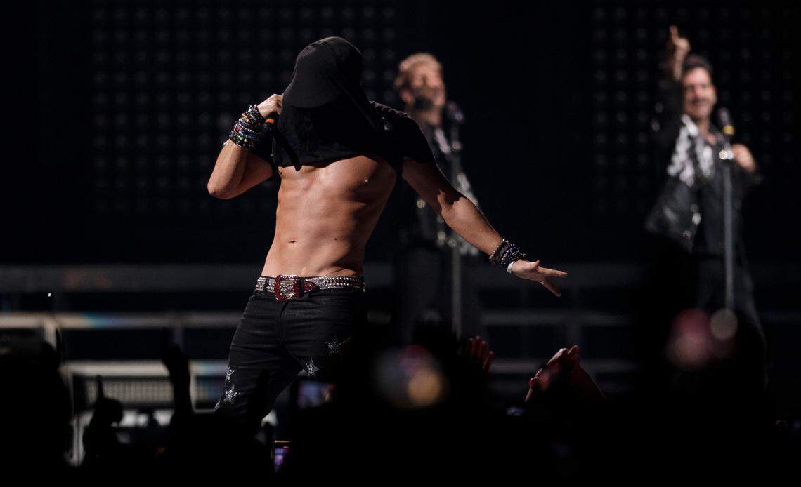 Donnie Walhberg pulls his shirt over his head as he shows off his famous torso with New Kids on the Block in concert on the “Mixtape 2022 Tour” at Raleigh, N.C.’s PNC Arena, Friday night, July 22, 2022.