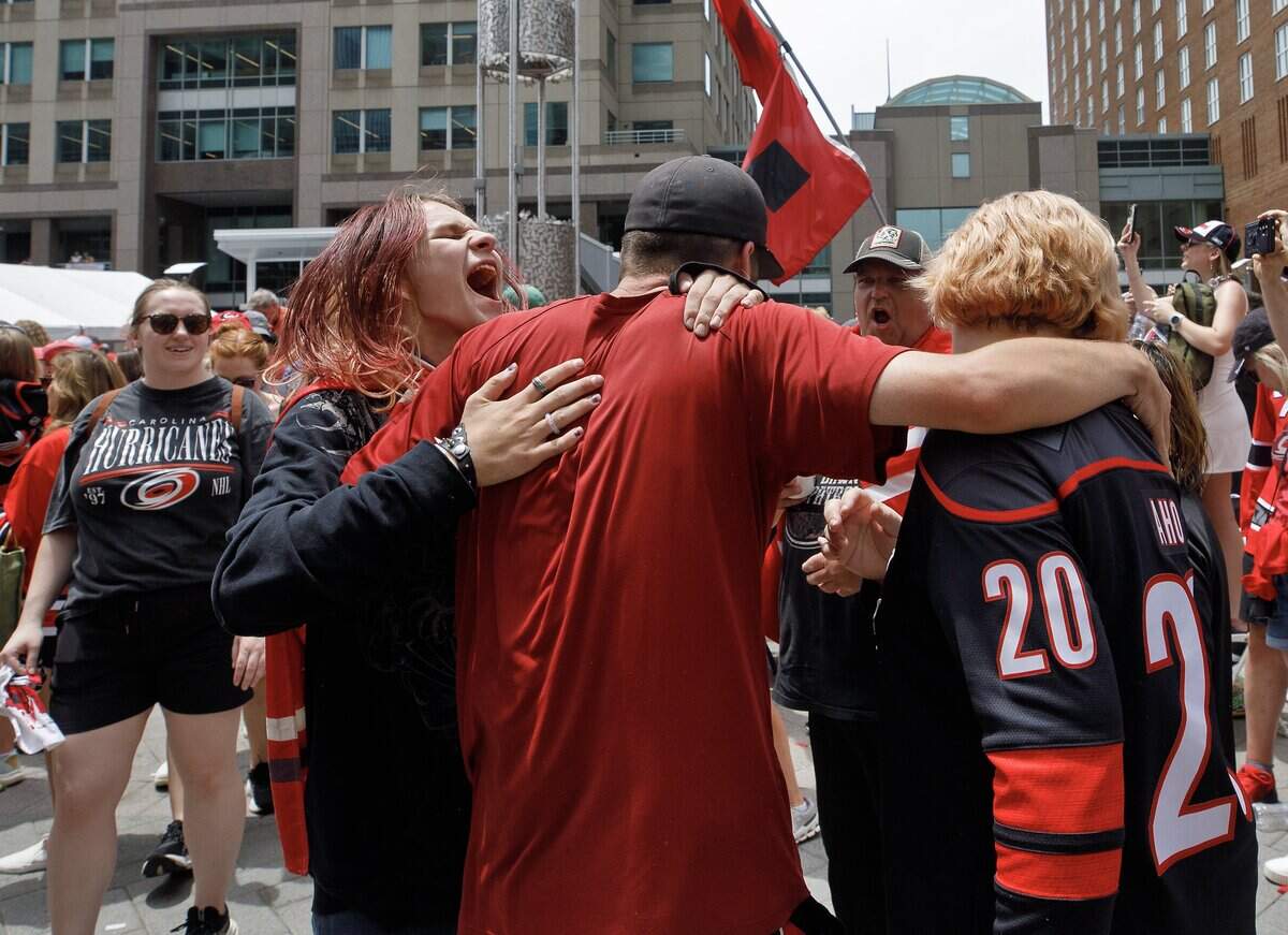 Jayden Williams, left, smiles at the conclusion of a rally honoring the Carolina Hurricanes’ 2026 Stanley Cup victory on Saturday, June 20, 2026, in Raleigh, N.C.