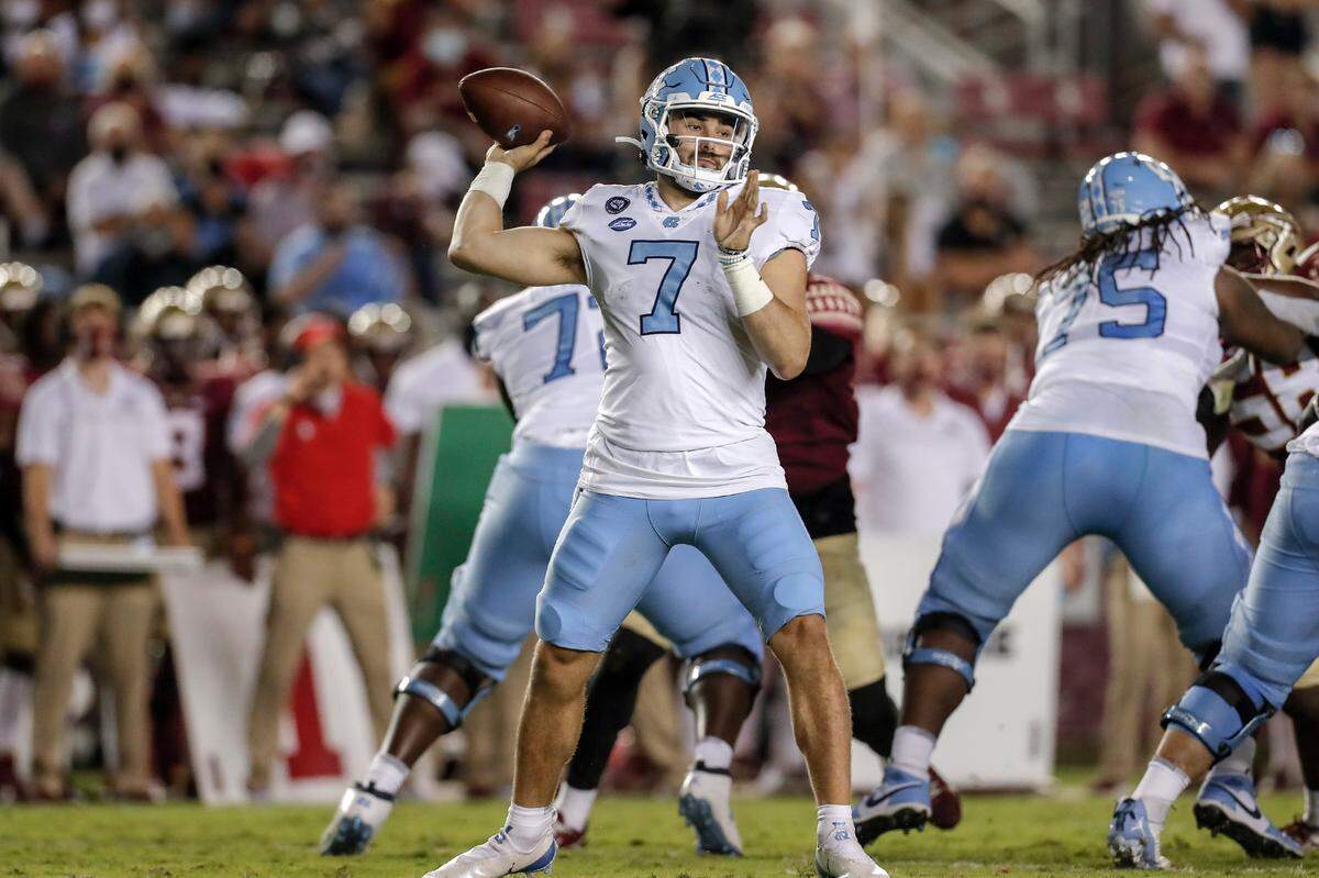 Quarterback Sam Howell of the North Carolina Tar Heels on a pass play during the game against the Florida State Seminoles at Doak Campbell Stadium on Bobby Bowden Field on October 17, 2020 in Tallahassee, Florida.