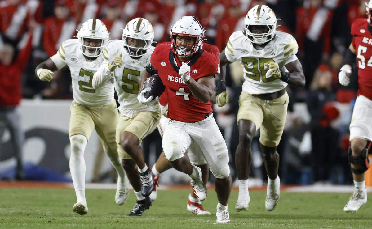 N.C. State’s Duke Scott (4) scrambles for a 69-yard rush during the second half of N.C. State’s 48-36 victory over Georgia Tech at Carter-Finley Stadium in Raleigh, N.C., Saturday, Nov. 1, 2025.