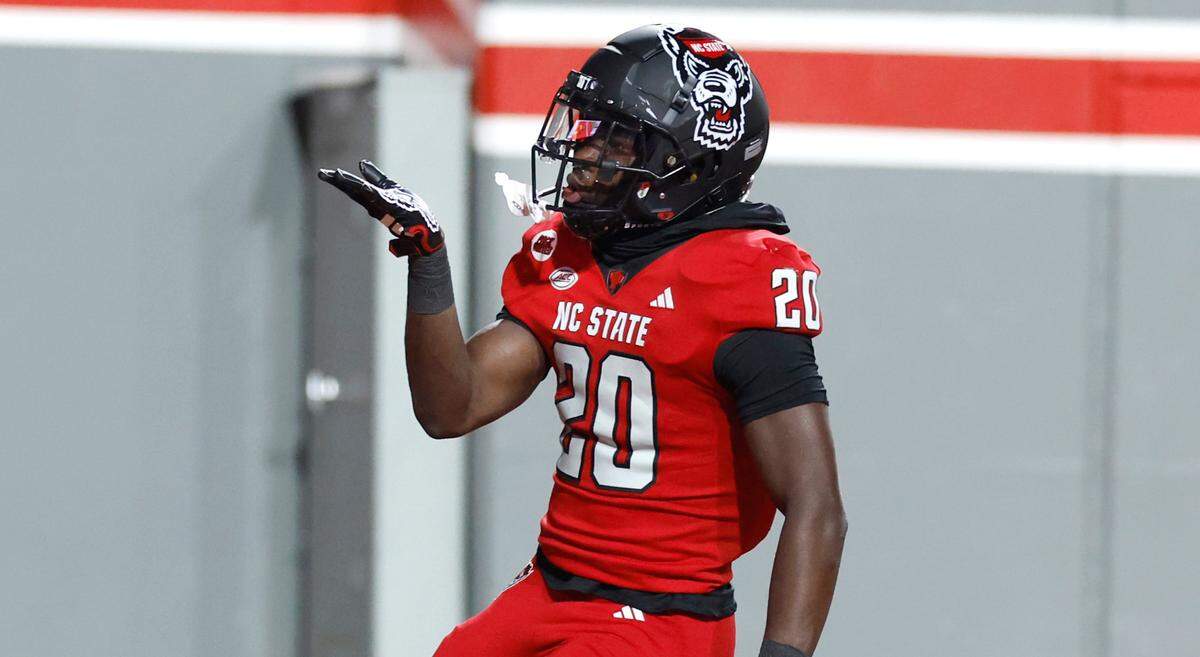 N.C. State running back Kendrick Raphael (20) blows a kiss after scoring on a 31-yard touchdown run during the second half of N.C. State’s 20-6 victory over Miami at Carter-Finley Stadium in Raleigh, N.C., Saturday, Nov. 4, 2023.