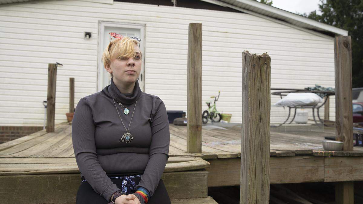 Saun Phelps poses for a portrait at their home in Semora, N.C., on June 25, 2021. Phelps is non-binary and lives in a rural part of the state.