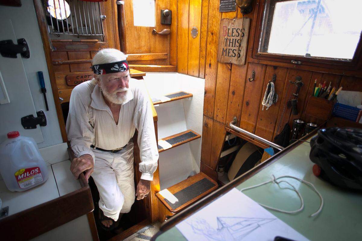 Captain Horatio climbs from his Captain’s quarters aboard his Meka II on Monday, June 25, 2018 in Beaufort, N.C. He has lived aboard the ship he build for more than 50 years.