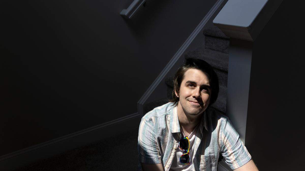 Woody Rini, who identifies as non-binary and uses they/them pronouns, is photographed at their Cary, N.C. home on Thursday, June 29, 2023.