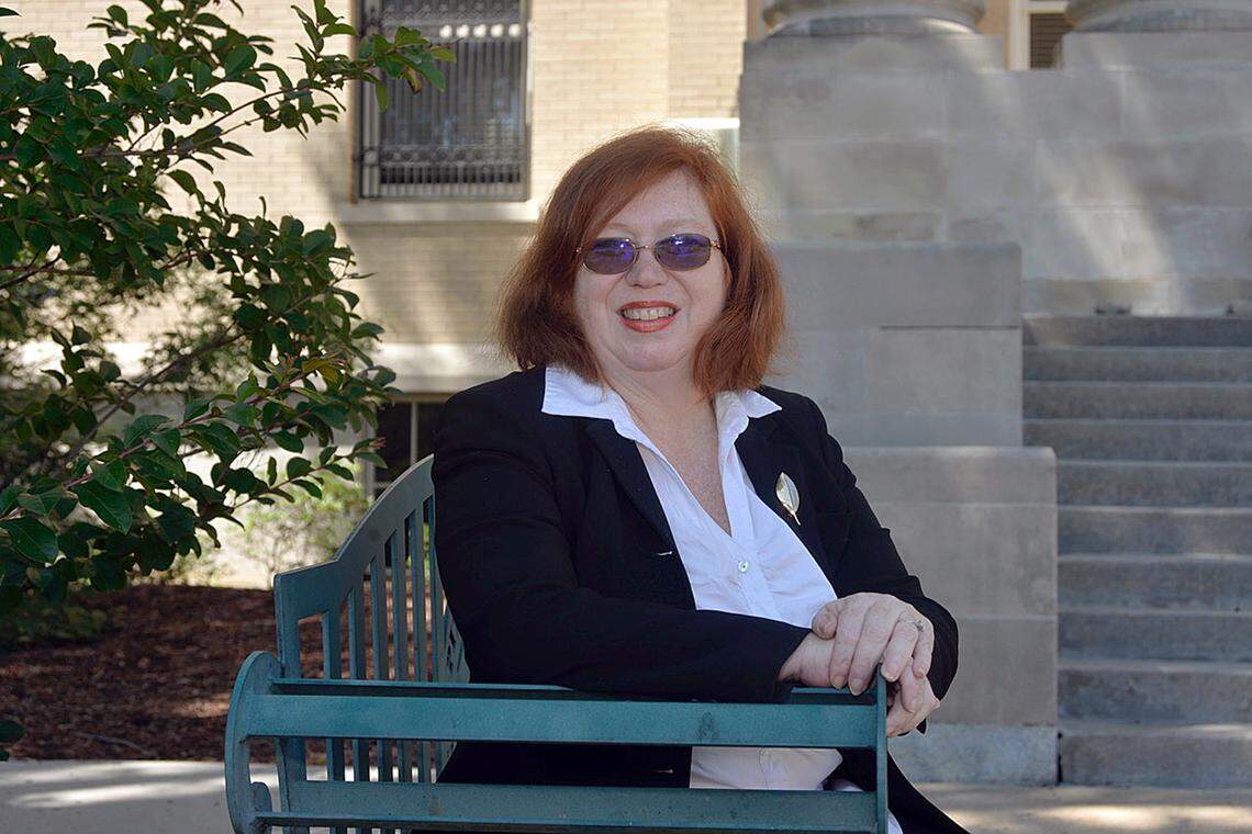Valerie Pearce, an assistant district attorney in Pitt County, sits in front of the courthouse in Greenville. She describes facing a substantial backlog of sex crime cases that have been delayed.