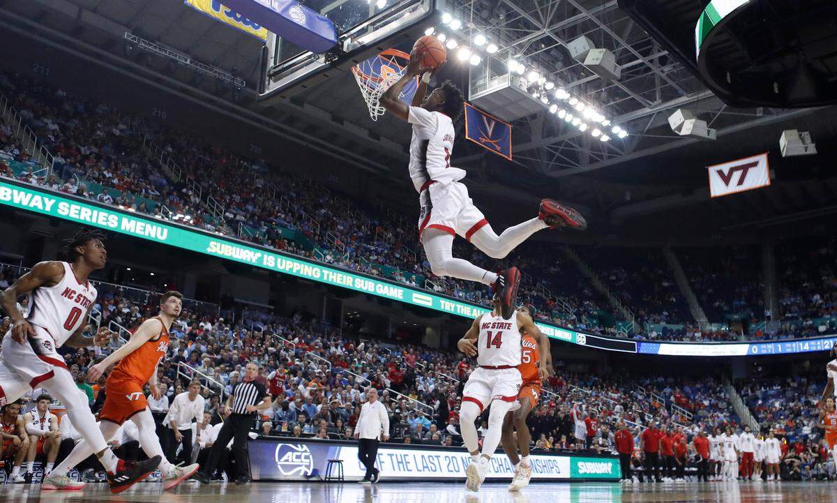 N.C. State’s Jarkel Joiner (1) puts in two on a pass from Terquavion Smith (0) during N.C. State’s 97-77 victory over Virginia Tech in the second round of the ACC Men’s Basketball Tournament in Greensboro, N.C., Wednesday, March 8, 2023.