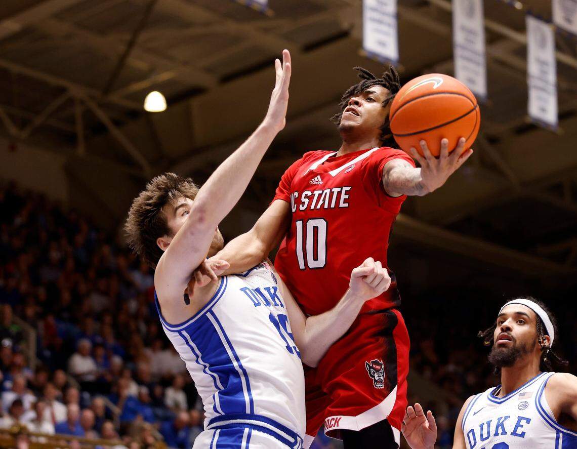 North Carolina State’s Breon Pass drives against Duke’s Ryan Young during the first half of Duke’s final regular-season home game against N.C. State on Tuesday, Feb. 28, 2023, at Cameron Indoor Stadium in Durham, N.C.