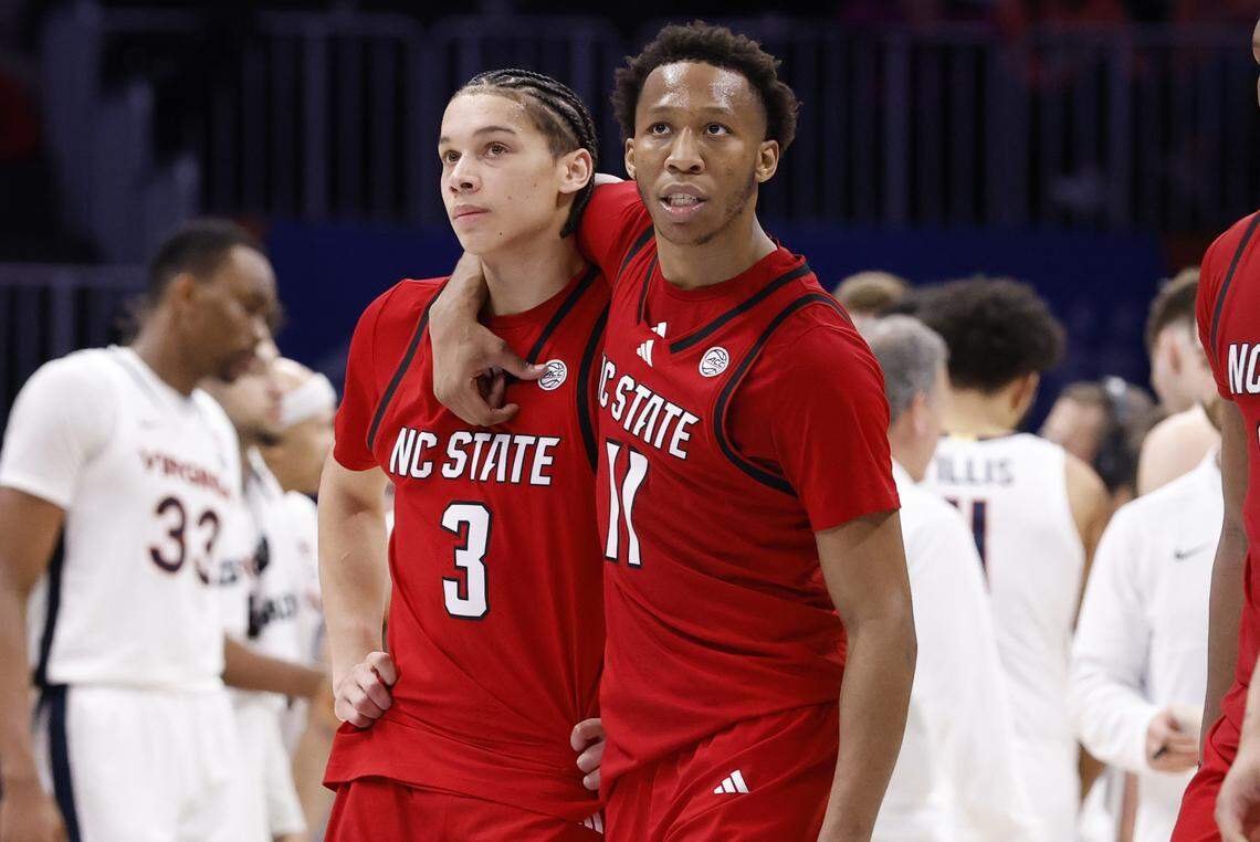 N.C. State's Quadir Copeland (11) and N.C. State's Matt Able (3) walk back to the bench after a timeout late in the second half of Virginia’s 81-74 victory over N.C. State in the quarterfinals of the 2026 ACC Men’s Basketball Tournament at the Spectrum Center in Charlotte, N.C., Thursday, March 12, 2026.