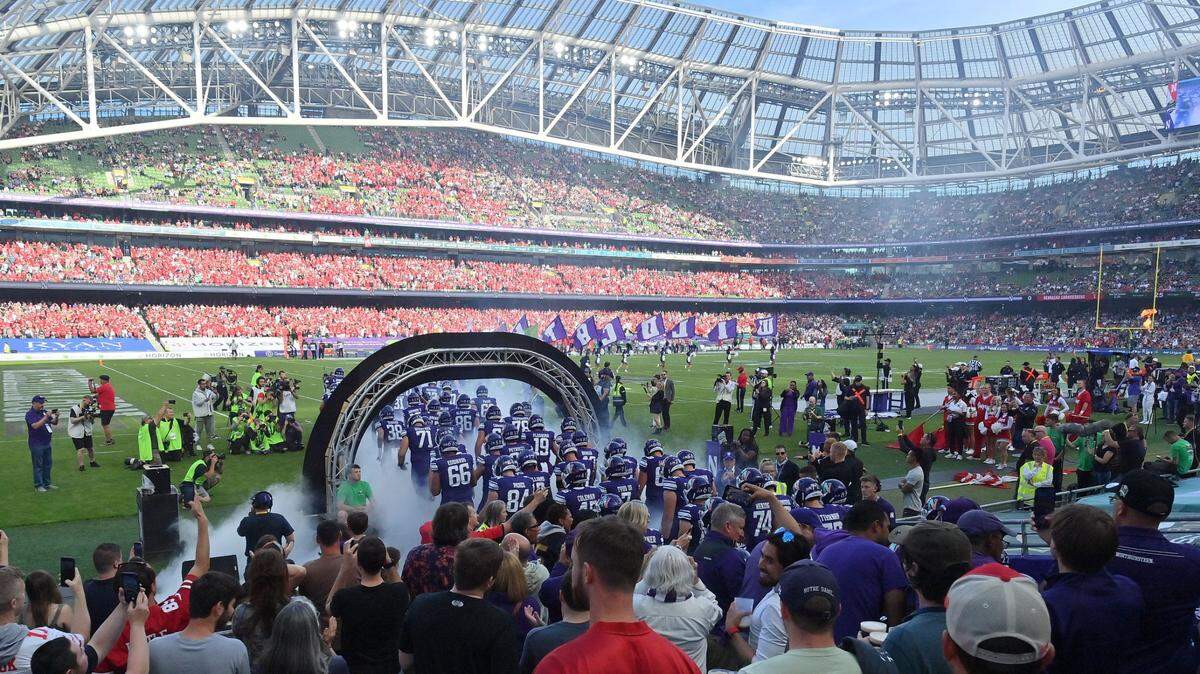 Aug 27, 2022; Dublin, IRELAND; Northwestern Wildcats players walk out onto the field before the Aer Lingus college football series game against Nebraska at Aviva Stadium. Mandatory Credit: Brendan Moran-USA TODAY Sports