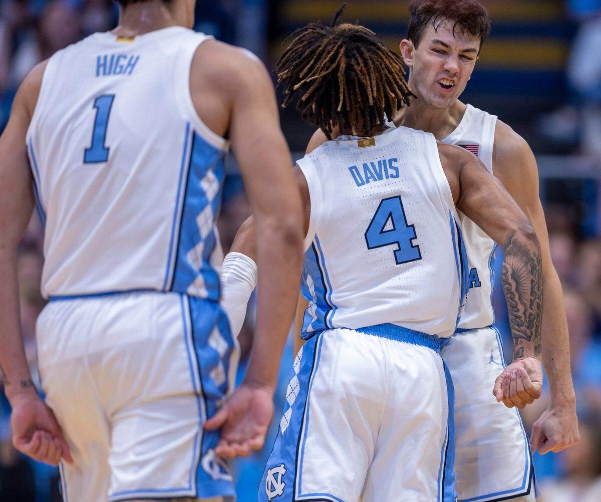 North Carolina’s Cormac Ryan (3) chest bumps R.J. Davis (4) after an assist to Davis for a basket in the first half against Lehigh on Sunday, November 12, 2023 at the Smith Center in Chapel Hill, N.C.