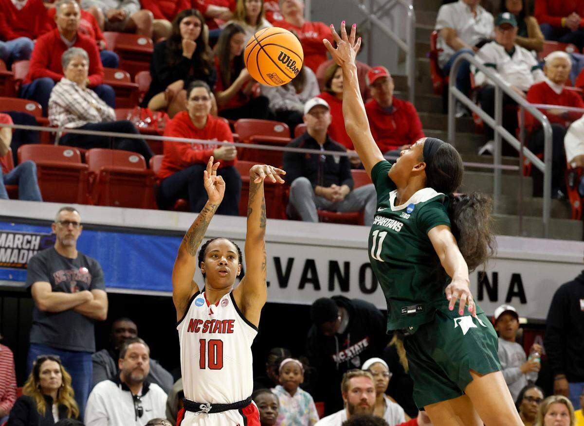 N.C. State’s Aziaha James shoots over Michigan State’s Jocelyn Tate during the second half of the Wolfpack’s 83-49 victory in the second round of the NCAA Tournament on Monday, March 24, 2025, at Reynolds Coliseum in Raleigh, N.C.