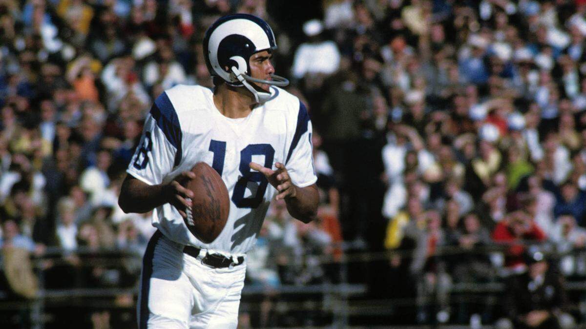 Oct 27, 1968; Baltimore, MD, USA; FILE PHOTO; Los Angeles Rams quarterback Roman Gabriel (18) at the line of scrimmage against the Baltimore Colts at Memorial Stadium.