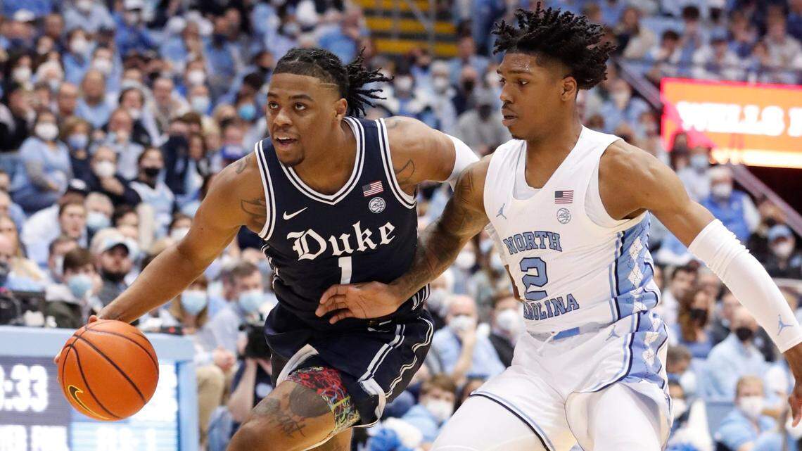 Dukes Trevor Keels (1) drives past North Carolina’s Caleb Love (2) during the second half of Dukes 87-67 victory over UNC at the Smith Center in Chapel Hill, N.C., Saturday, Feb. 5, 2022.