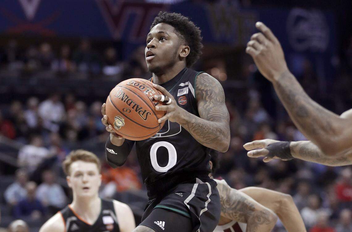 Miami’s Chris Lykes (0) drives to the basket against Virginia Tech during the first half of an NCAA college basketball game in the Atlantic Coast Conference tournament in Charlotte, N.C., Wednesday, March 13, 2019.
