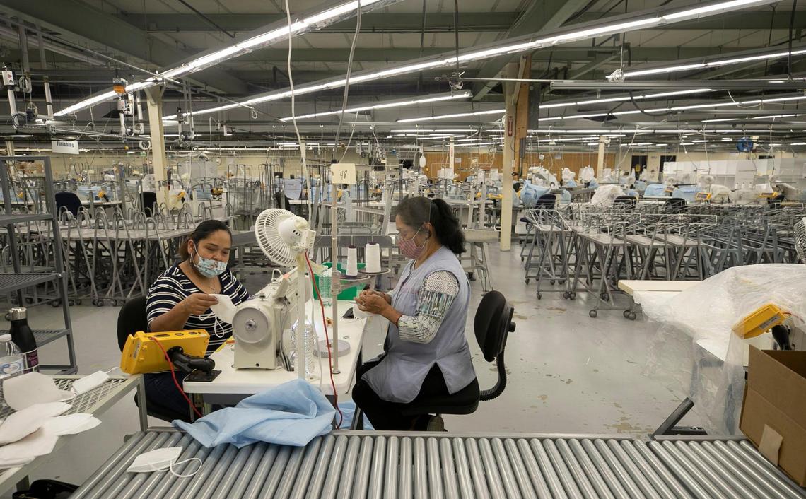 Only a few employees remain from the more than 100 employed at the Garland Shirt Company on Thursday, July 16, 2020. Most of the work being done is finishing the last of the Brooks Brothers shirts and producing protective masks for use in the COVID-19 pandemic.