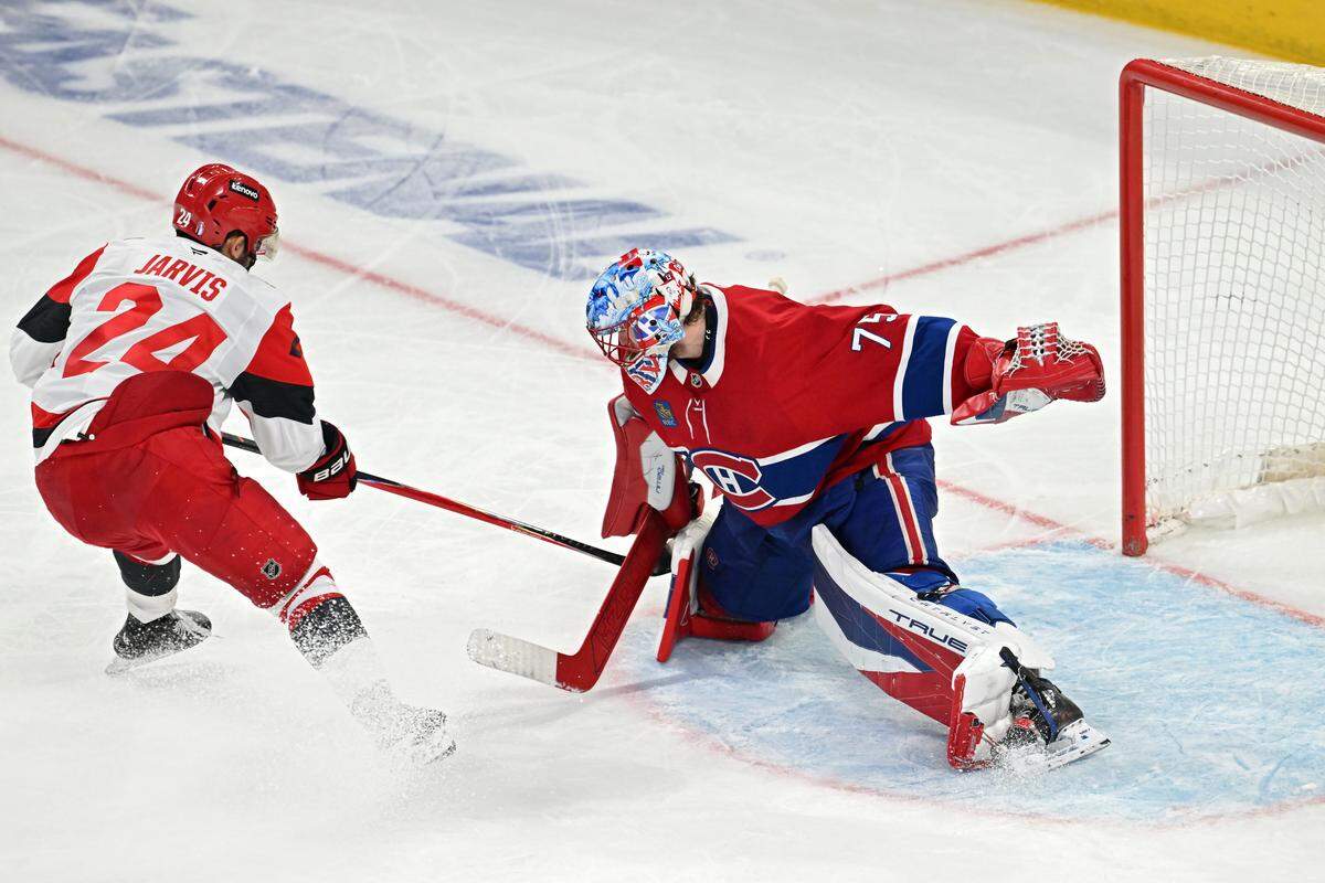 Jakub Dobes #75 of the Montreal Canadiens saves a shot attempt by Seth Jarvis #24 of the Carolina Hurricanes during the third period in Game Four of the Eastern Conference Final of the 2026 Stanley Cup Playoffs at Bell Centre on May 27, 2026 in Montreal, Quebec, Canada.