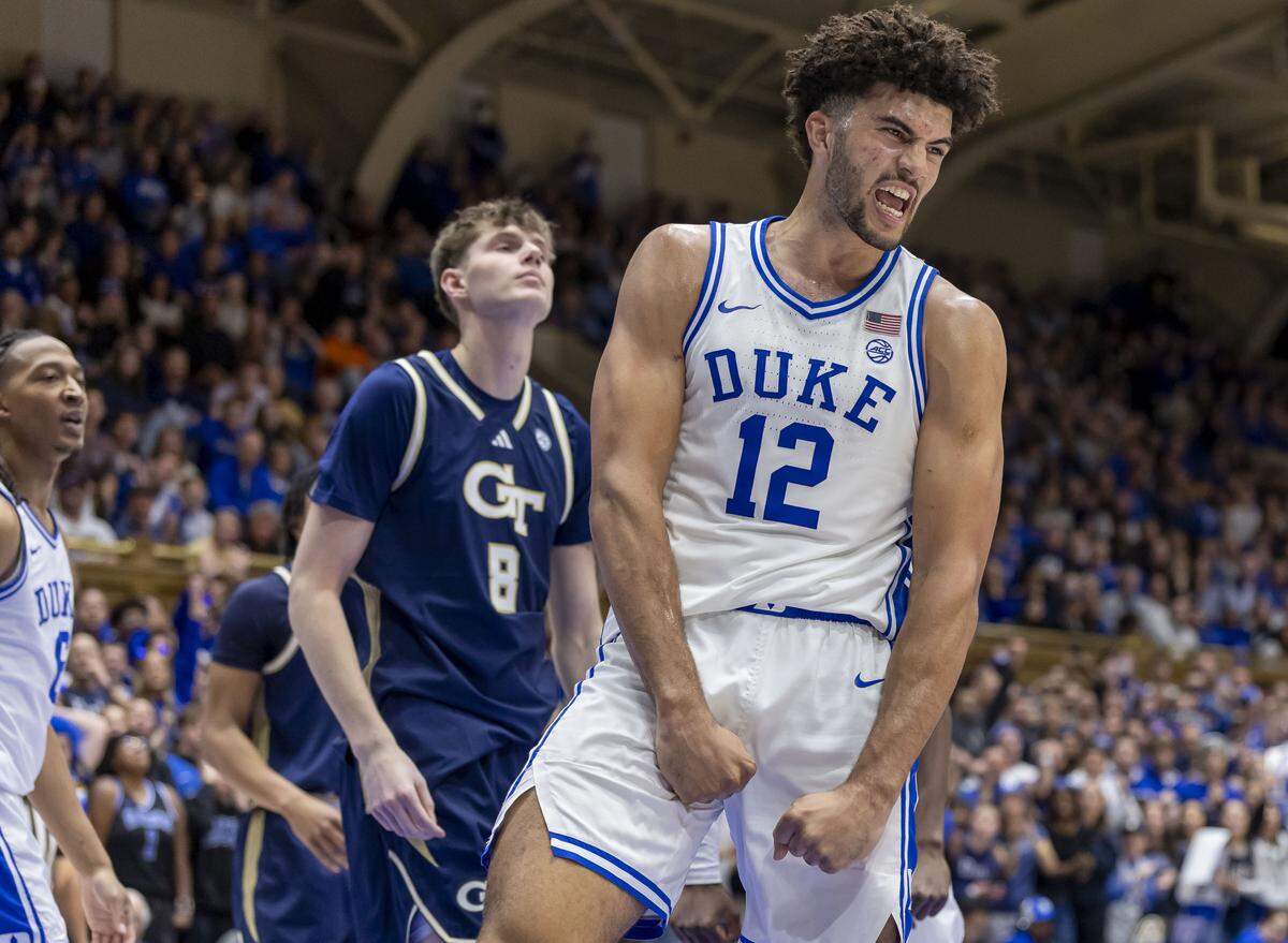 Duke forward Cameron Boozer (12) reacts after scoring a basket and drawing a foul in the second half against Georgia Tech on Wednesday, December 31, 2025 at Cameron Indoor Stadium in Durham, N.C. Boozer lead all scores with 26 points in the Blue Devils’ 85-79 victory.