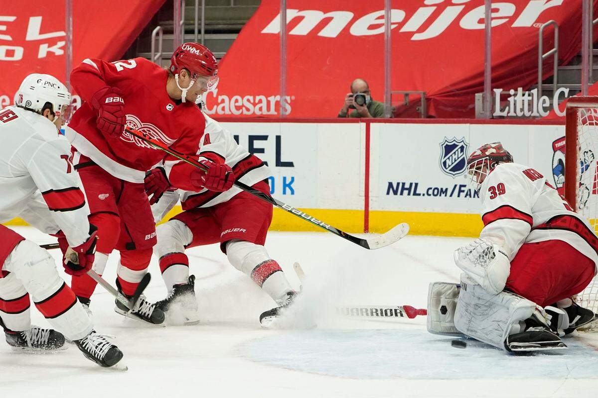 Carolina Hurricanes goaltender Alex Nedeljkovic (39) stops a Detroit Red Wings center Vladislav Namestnikov (92) shot in the second period of an NHL hockey game Sunday, March 14, 2021, in Detroit. (AP Photo/Paul Sancya)