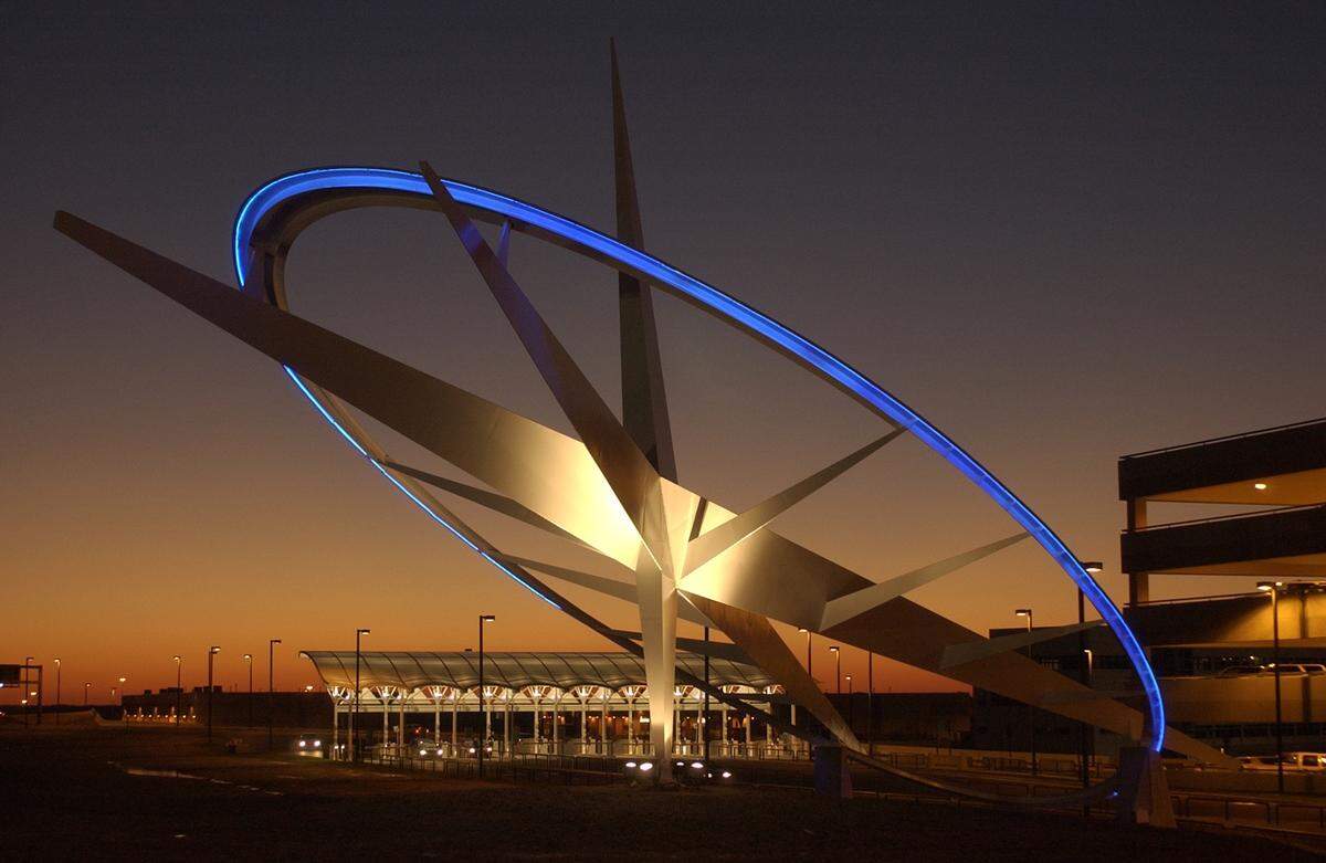 The Triangle Icon sculpture honoring the Wright Brothers as the sun set on the day it was dedicated, Dec. 17, 2003, at Raleigh-Durham International Airport.