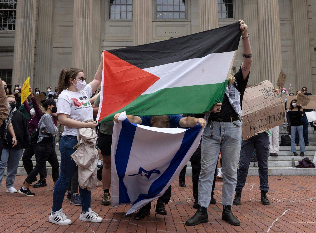 Pro-Palestinian demonstrators and counter-protesters interact during a rally in support of Palestinians at UNC-Chapel Hill on Thursday, Oct. 12, 2023. The rally was organized by the UNC chapter of Students for Justice in Palestine.