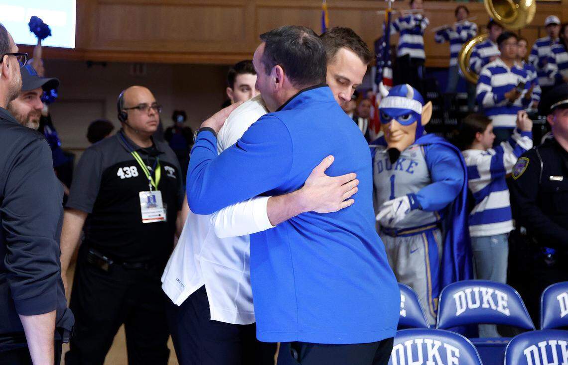 Former Duke head coach Mike Krzyzewski hugs head coach Jon Scheyer as Scheyer comes out onto the floor before Duke’s game against Notre Dame at Cameron Indoor Stadium in Durham, N.C., Tuesday, Feb. 14, 2023.