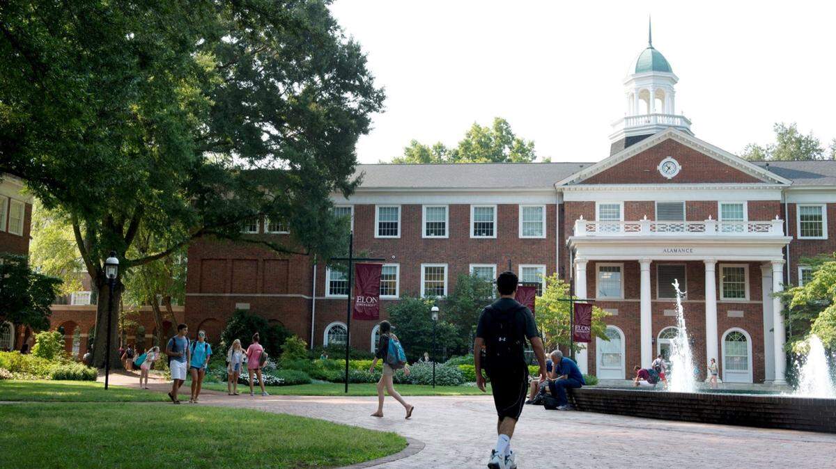Students approach the Alamance Building on the campus of Elon University. (Photo courtesy of Elon University)