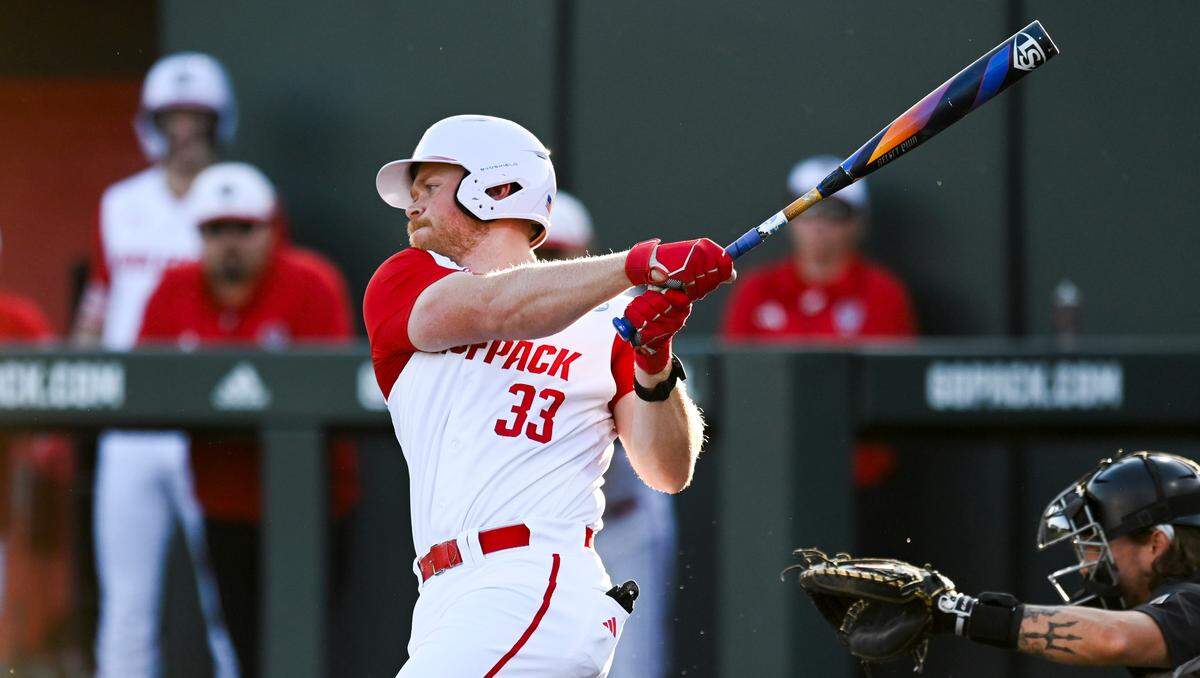 N.C. State’s Garrett Pennington (33) connects with the ball during N.C. State’s 9-2 victory against Bryant in the NCAA Raleigh Regional at Doak Field on Friday, May 31, 2024.