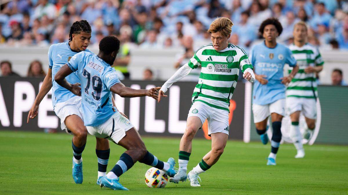 Manchester City defender Luke Mbete (79) works to protect the goal as Celtic FC forward Furuhashi Kyogo (8) dribbles the ball during the Celtic FC vs Manchester City at Kenan Stadium in Chapel Hill on Tuesday, July 23, 2024. Celtic FC won 4-3.
