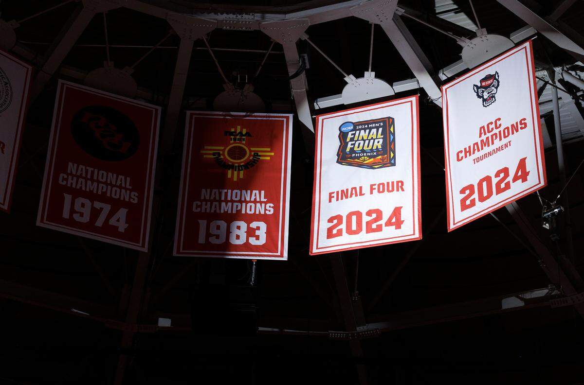 N.C. State unveils banners to commemorate its 2024 NCAA Tournament Final Four appearance and ACC Tournament championship prior to the Wolfpack’s season-opening game against USC Upstate on Monday, Nov. 4, 2024, at the Lenovo Center in Raleigh, N.C.