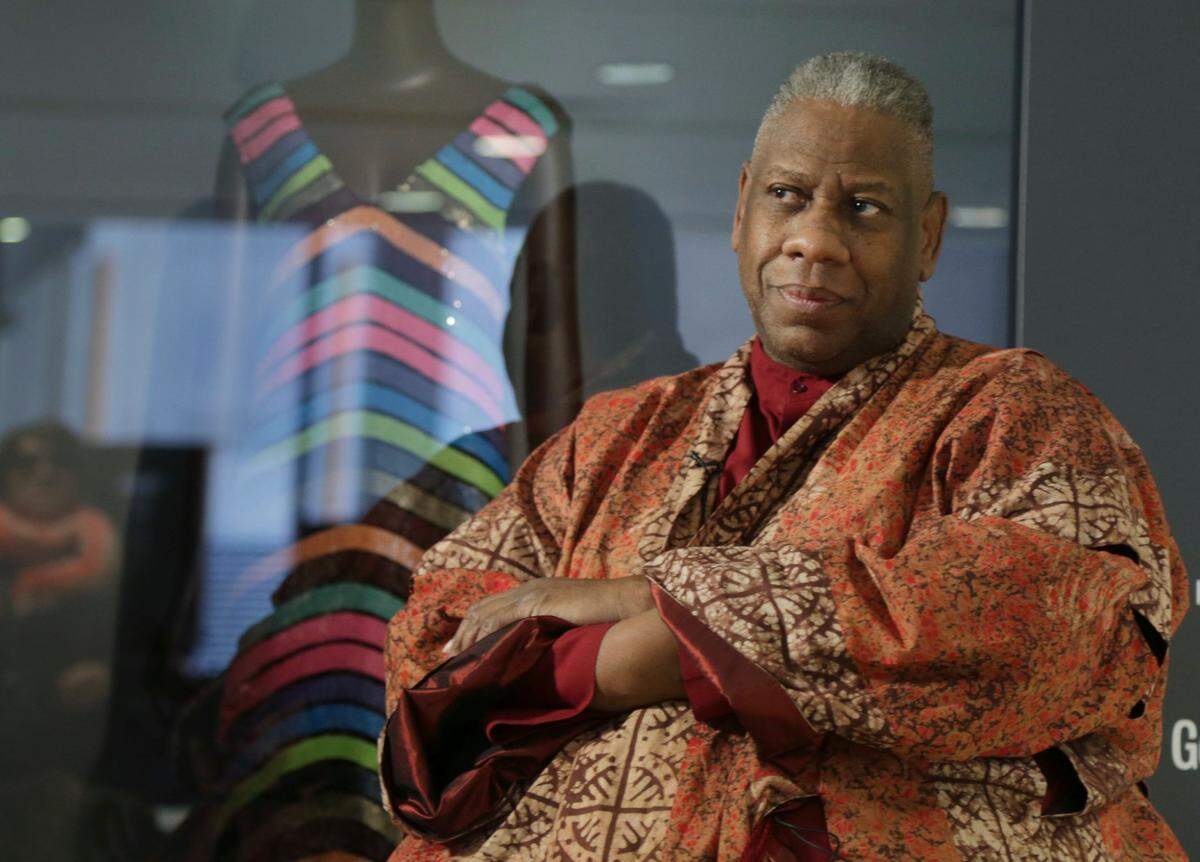 André Leon Talley, a former editor at large for Vogue magazine, speaks to a reporter at the opening of the “Black Fashion Designers” exhibit at the Fashion Institute of Technology in New York, Tuesday, Dec. 6, 2016. Talley, the towering former creative director and editor at large of Vogue magazine, has died. He was 73. Talley’s literary agent confirmed Talley’s death to USA Today late Tuesday, Jan. 18, 2022.