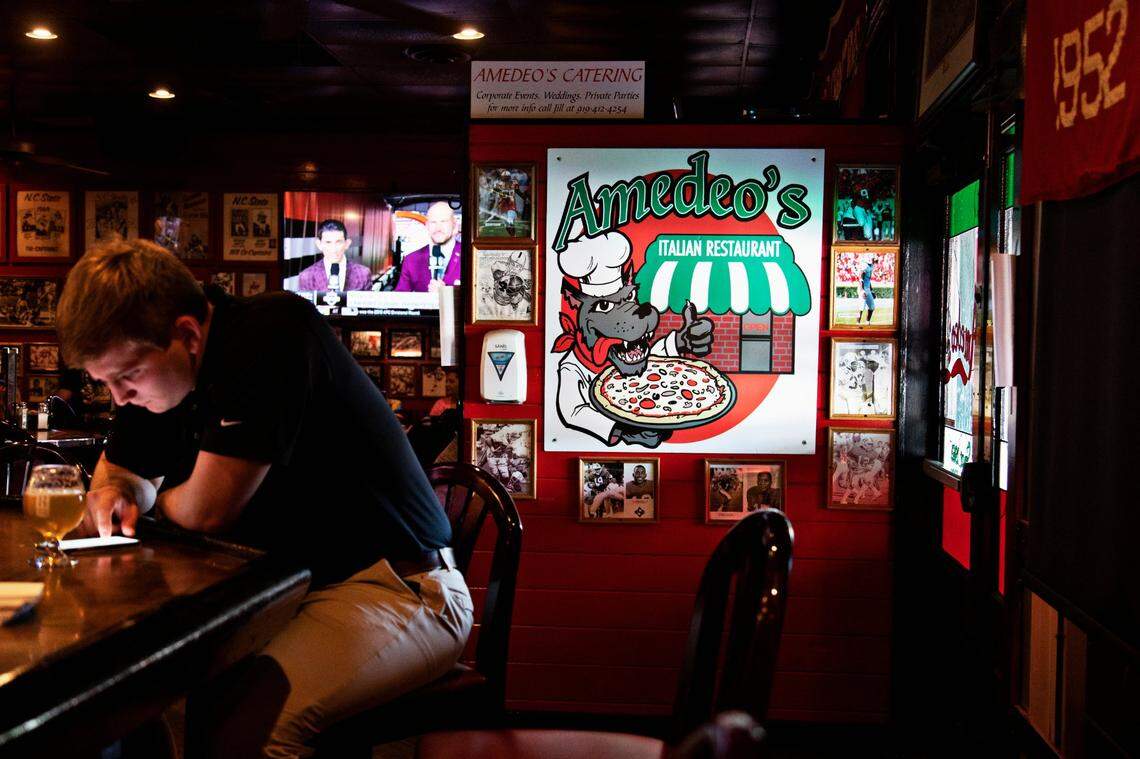 Almost 60 years of memories line the walls at Amedeo’s in Raleigh, the unofficial museum of NC State sports.