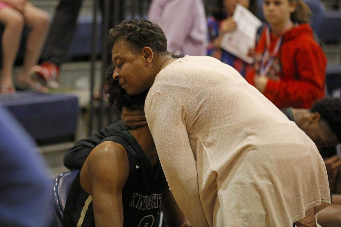 Coby White's mom, Bonita, embraces her son after a hard fought loss to Trinity Christian School. The two have a close relationship, and Coby said, “I might cry when I leave my mom" as he heads this summer to Chapel Hill as part of a top 10 basketball recruiting class at UNC.