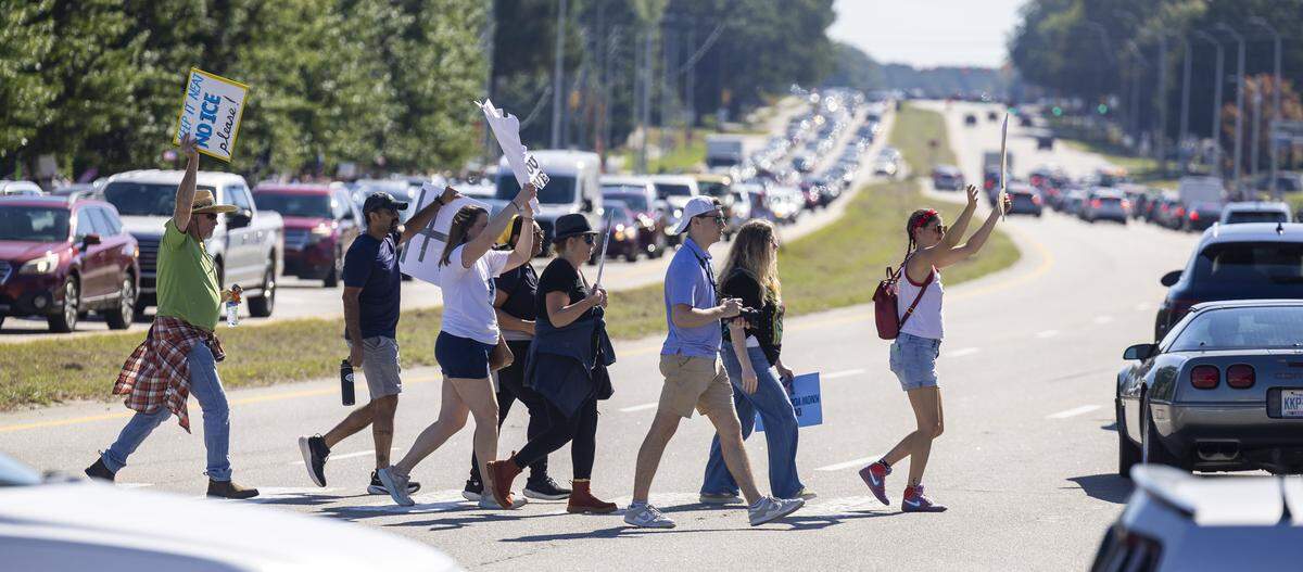 North bound traffic on Capital Blvd is backed up as ’No Kings’ demonstrators march across the intersection with Sumner Blvd. on Saturday, October 18, 2025 in Raleigh, N.C. 