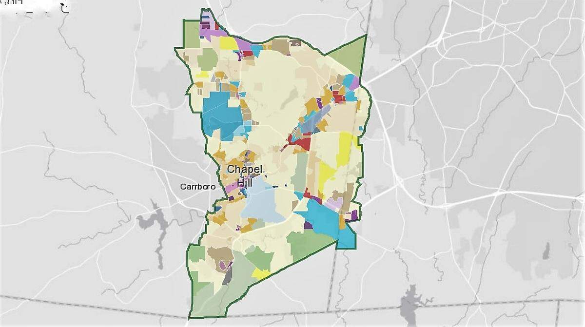 Chapel Hill’s zoning map shows most land is zoned for single-family homes (shown in cream and yellow). UNC and its related entities own another 30% of the town’s land, while more dense commercial and apartment development is built along major traffic corridors.
