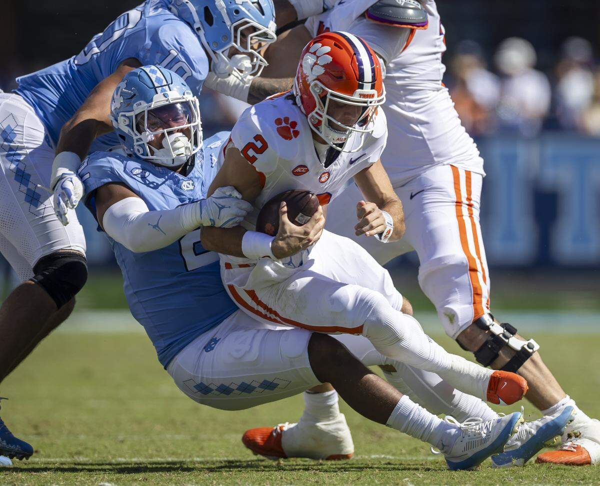 Clemson quarterback Cade Klubnik (2) is sacked by North Carolina linebacker Andrew Simpson (2) in the third quarter on Saturday, October 4, 2025 at Kenan Stadium in Chapel Hill, N.C. 