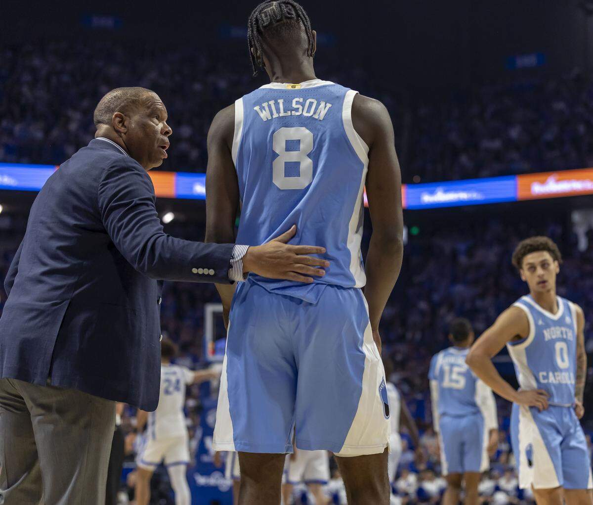 North Carolina coach Hubert Davis talks with Caleb Wilson (8) in the first half against Kentucky on Tuesday, December 2, 2025 at Rupp Arena in Lexington, Ky.