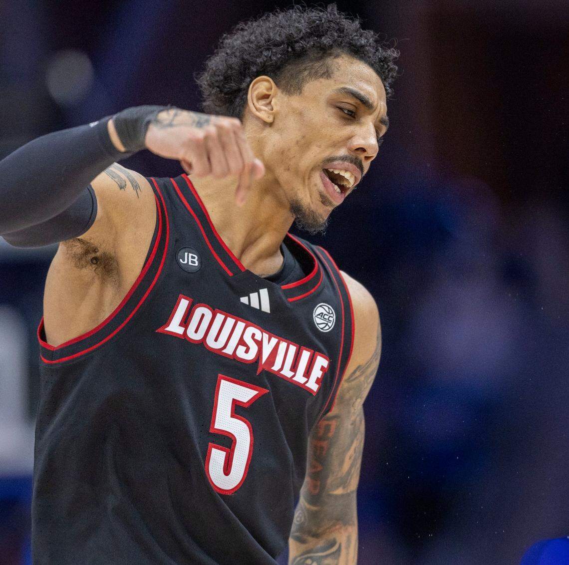 Louisville’s Terrence Edwards Jr. (5) reacts after sinking a basket to give the Cardinals a lead over Duke in the first half on Saturday, March 15, 2025 during the ACC Tournament Championship at Spectrum Center in Charlotte, N.C.