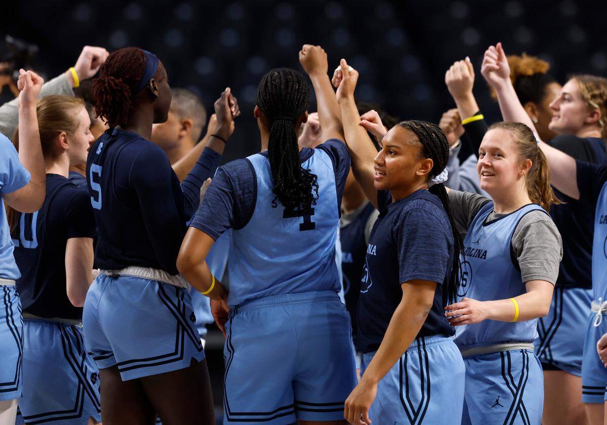 North Carolina’s Reniya Kelly and Sydney Barker huddle with teammates at the start of practice at Legacy Arena on Thursday, March 27, 2025, in Birmingham, Ala. The Tar Heels will face Duke in the NCAA Tournament Sweet 16 on Friday.  