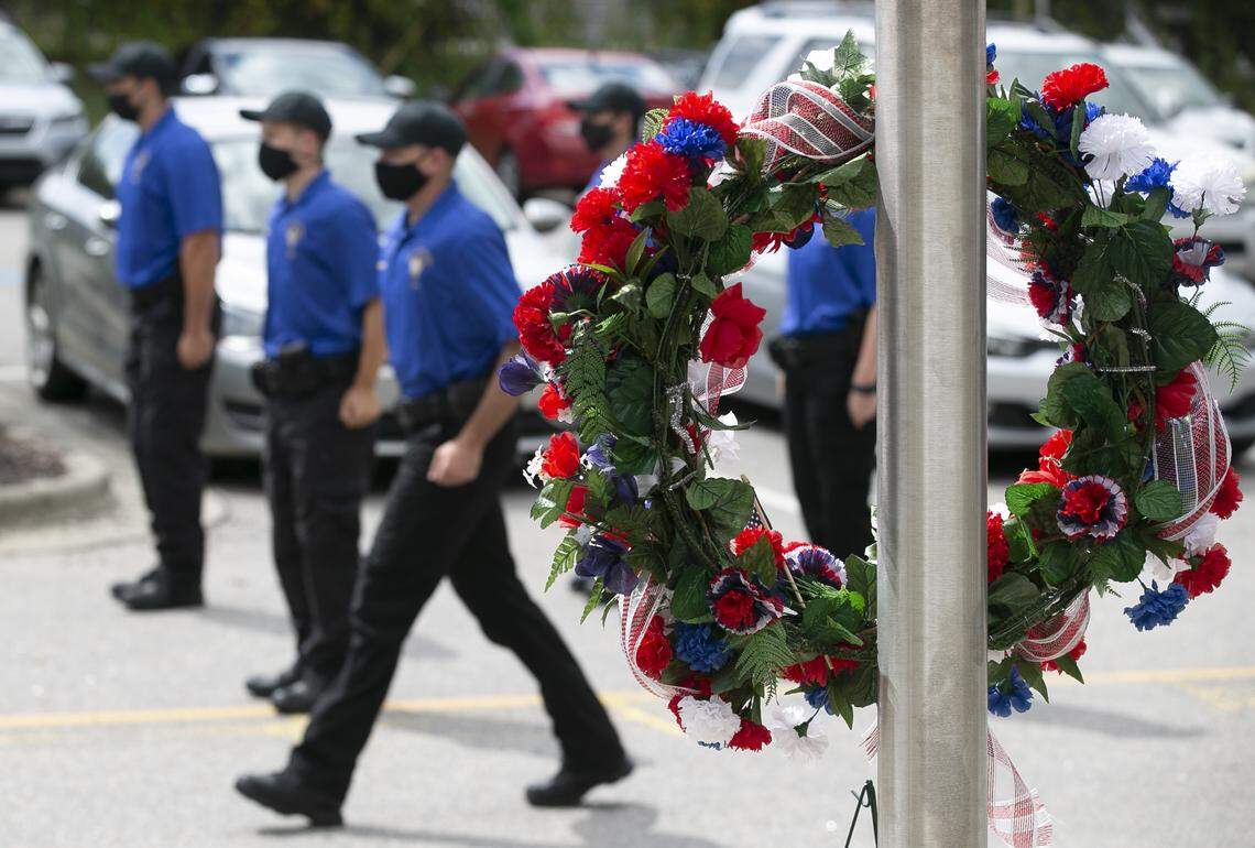 Members of the Wake Tech Community College Basic Law Enforcement Training class march past a memorial wreath marking the 19th anniversary of the Sept. 11, 2001, terrorist attack at the Chapanoke Road campus on Friday, September 11, 2020 in Raleigh, N.C.