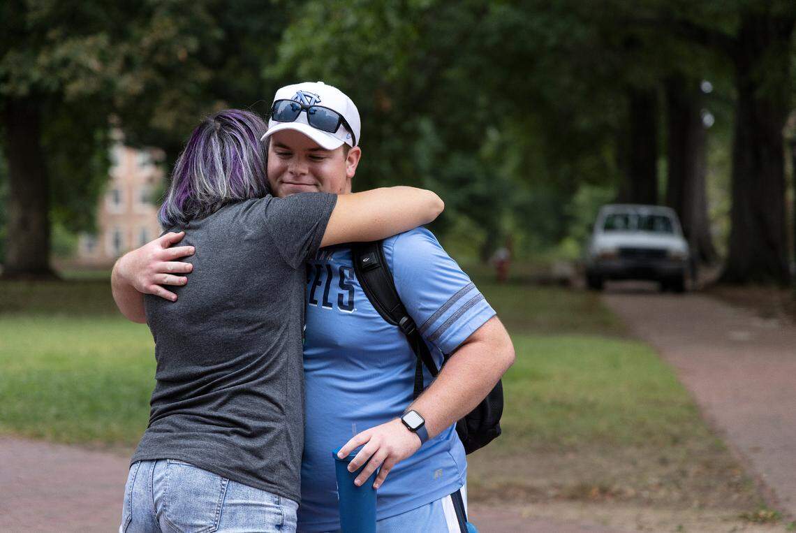 UNC-Chapel Hill first-year student Lucas Searles hugs Felicia Ostrander on Tuesday, Aug. 29, 2023, in Chapel Hill, N.C. following a Monday shooting that left a faculty member dead on the university campus.