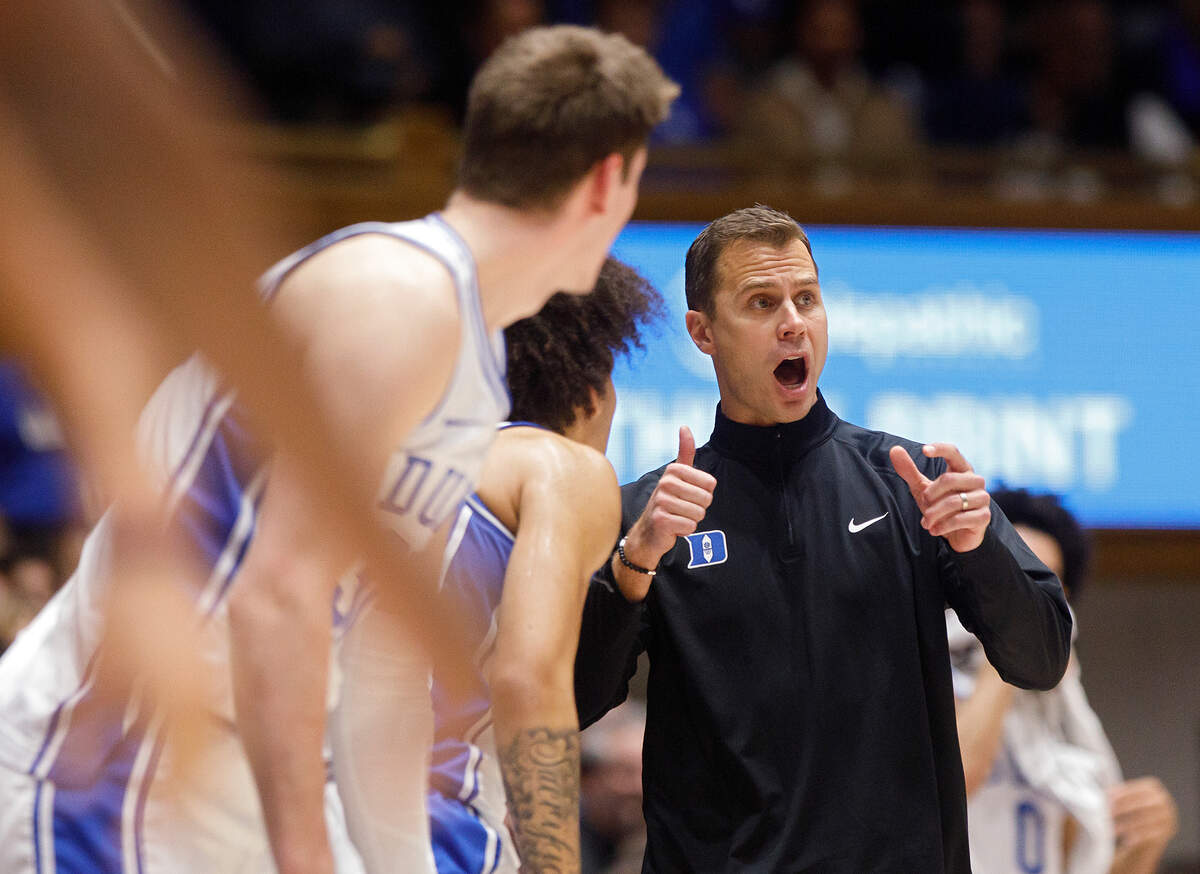 Duke head coach Jon Scheyer gives instructions to his team during the first half of the Blue Devils’ game against La Salle on Tuesday, Nov. 21, 2023, at Cameron Indoor Stadium in Durham, N.C.