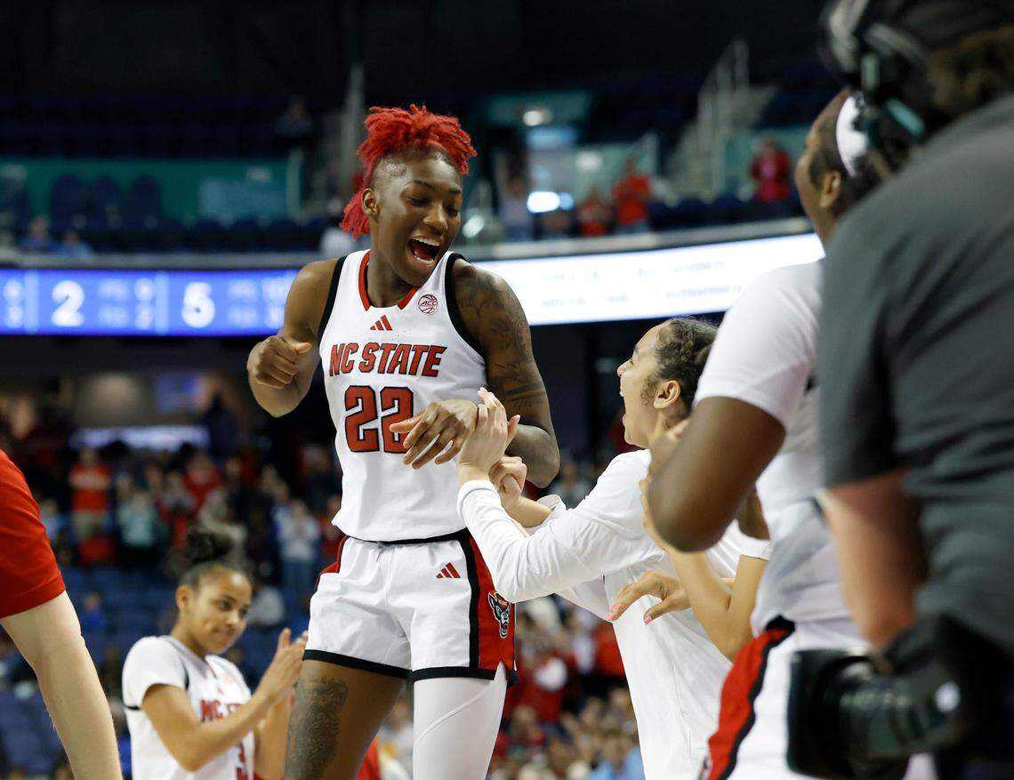 N.C. State’s Saniya Rivers and Devyn Quigley celebrate following the Wolfpack’s 66-55 win over North Carolina in the ACC Tournament semifinals on Saturday, March 8, 2025, at First Horizon Coliseum in Greensboro, N.C.