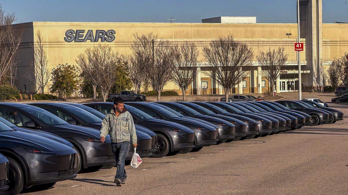 Nearly 200 Tesla Model Y electric vehicles are parked at Triangle Town Center in North Raleigh on Tuesday. Analysts note a nationwide trend of unsold electric vehicles being stored at malls. 