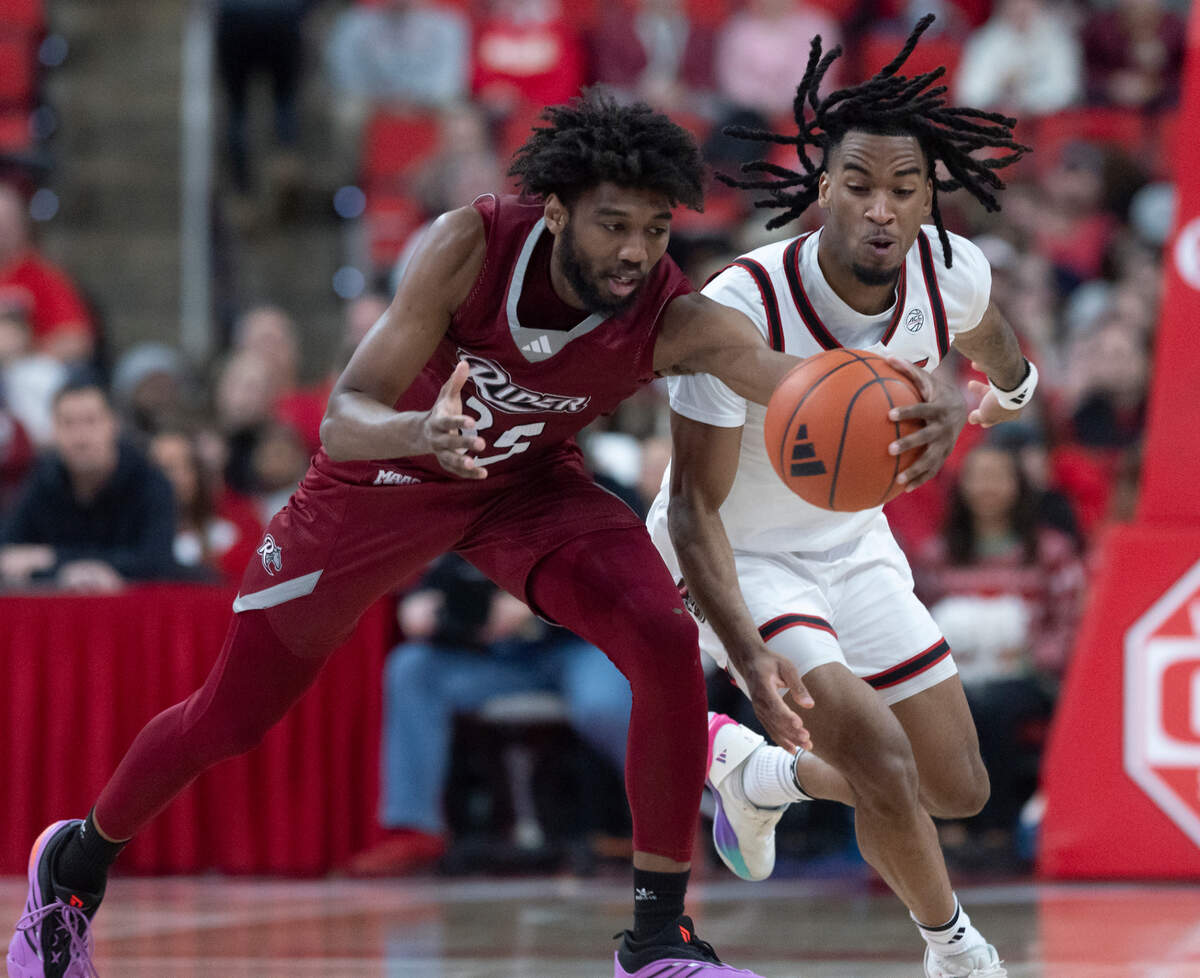 N.C. State’s Jayden Taylor pressures Rider’s T.J. Weeks Jr. during the first half of the Wolfpack’s game on Sunday, Dec. 22, 2024, at Lenovo Center in Raleigh, N.C.