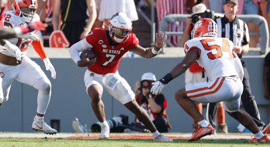 N.C. State quarterback MJ Morris (7) scrambles to avoid a sack during the first half of N.C. State’s game against Clemson at Carter-Finley Stadium in Raleigh, N.C., Saturday, Oct. 28, 2023.